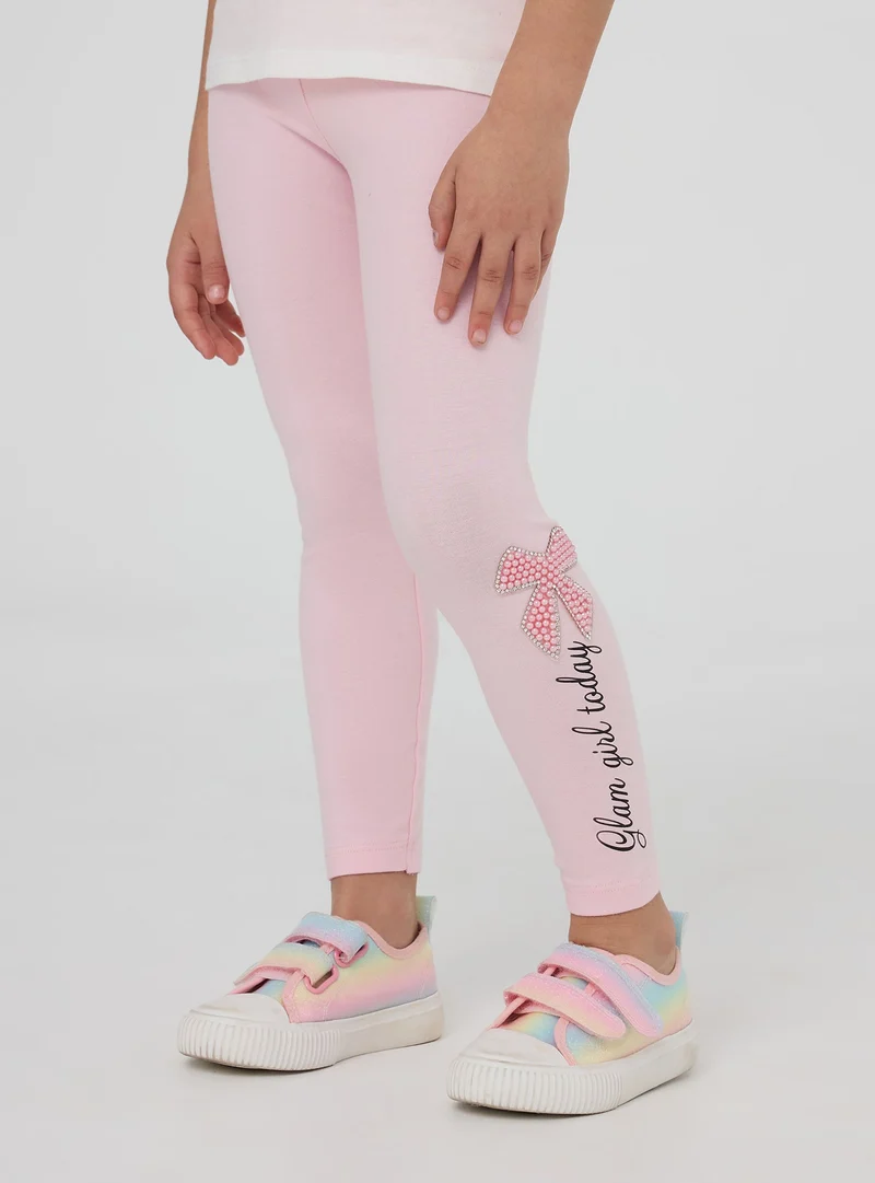 Leggings lunghi con scritta e applicazioni