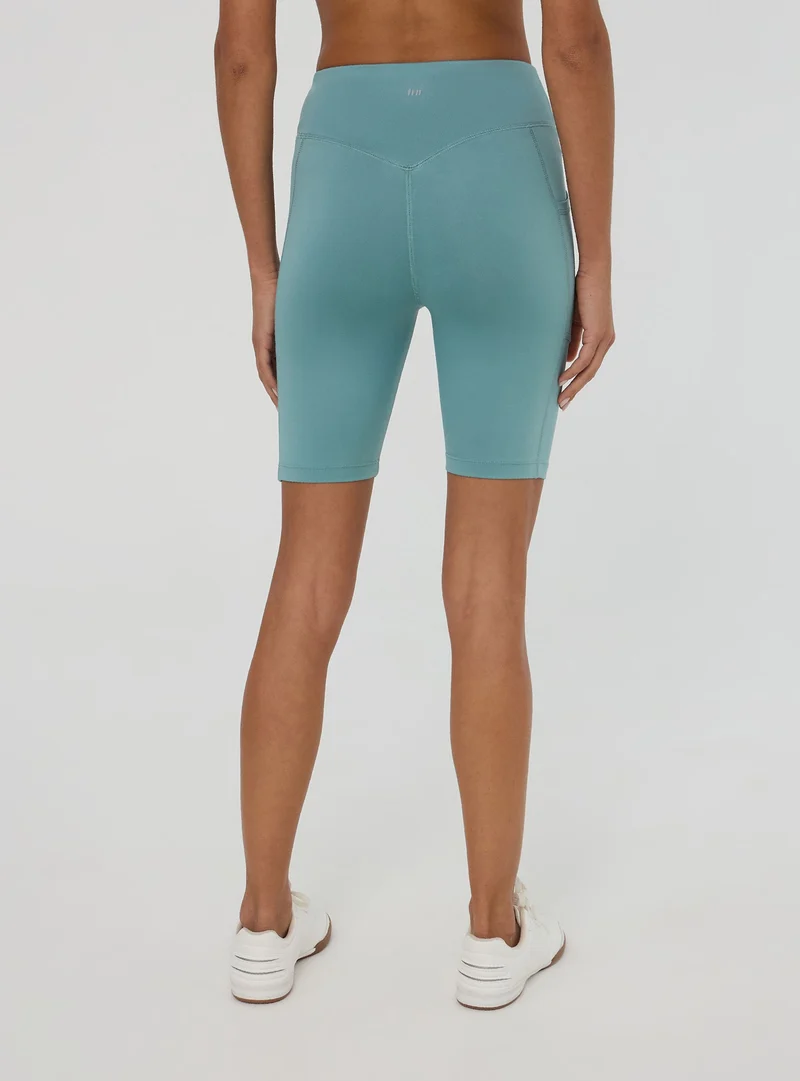 Leggings sportivi corti con tasca