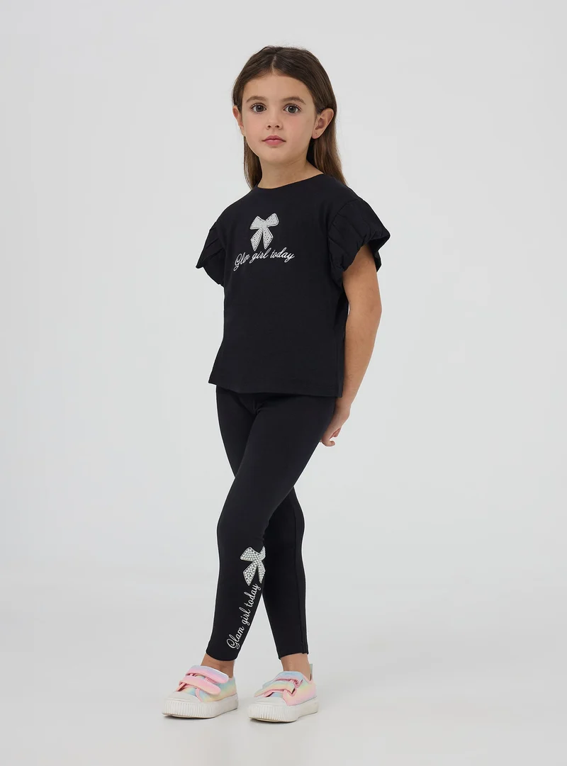 Leggings lunghi con scritta e applicazioni