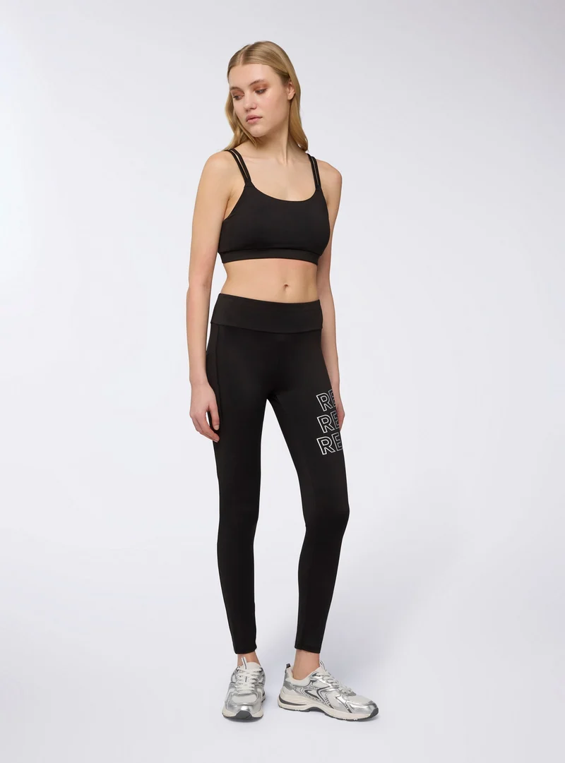 Leggings sportivi lunghi con tasca e scritte