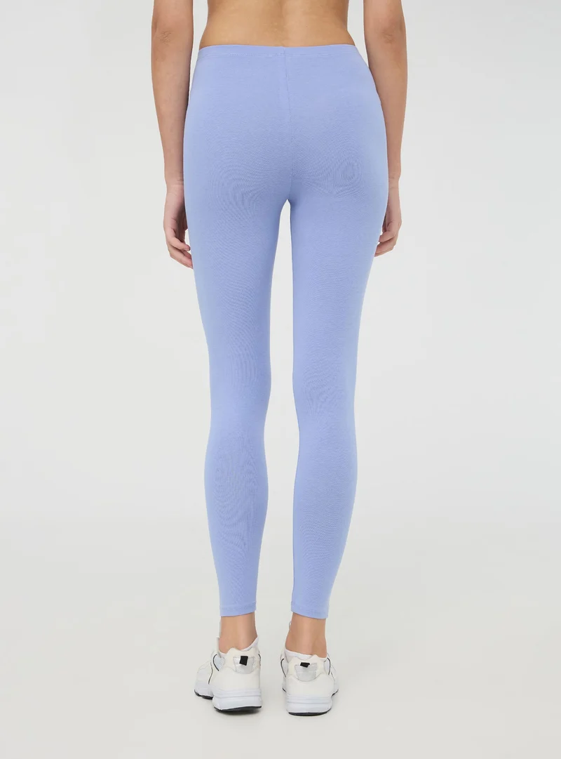 Leggings lunghi tinta unita in jersey stretch