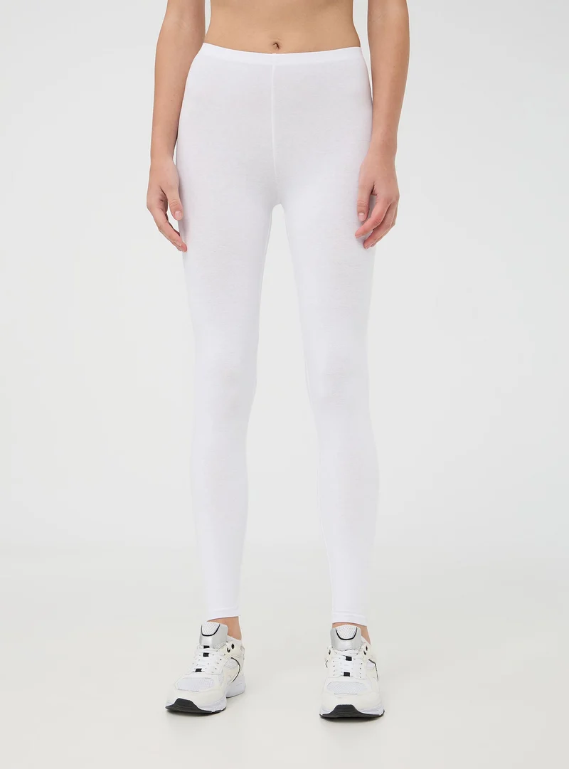 Leggings lunghi tinta unita in jersey stretch