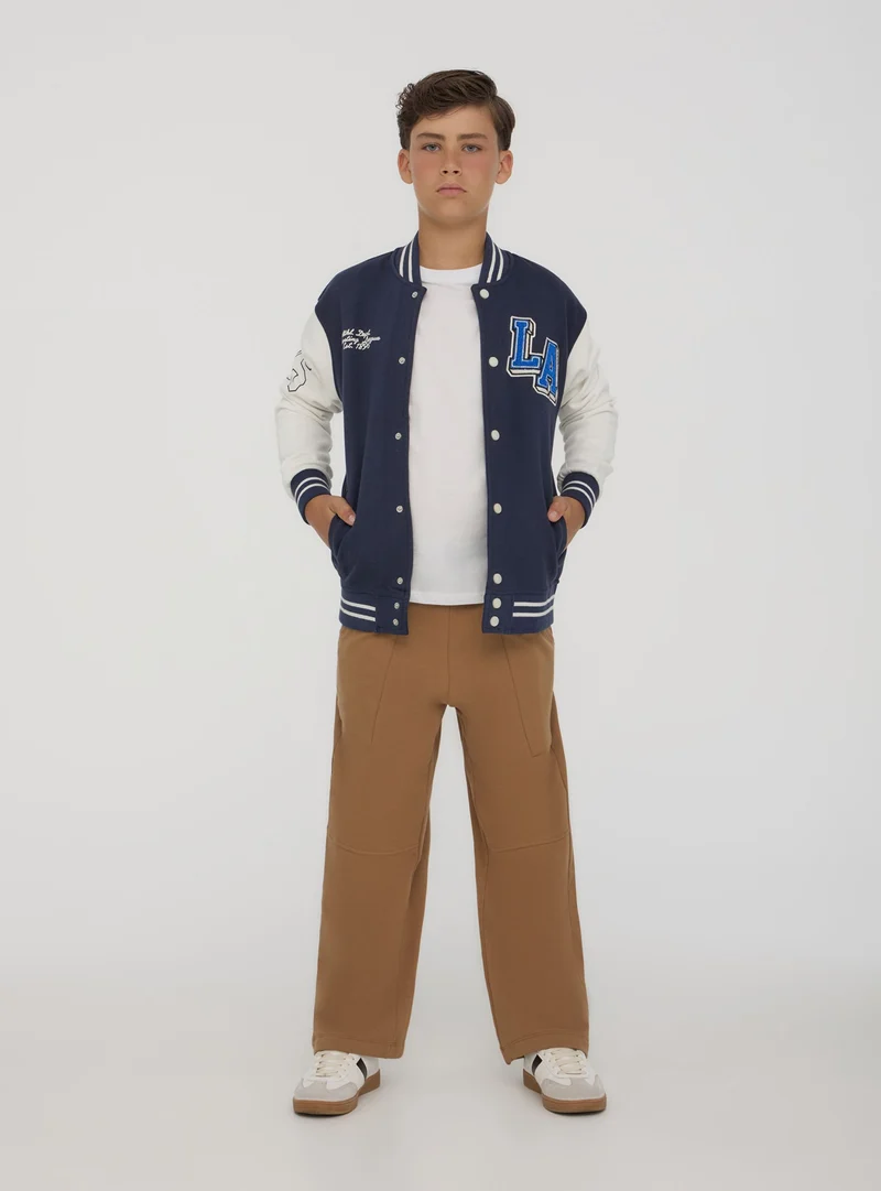 Giubbino bomber in felpa stile college