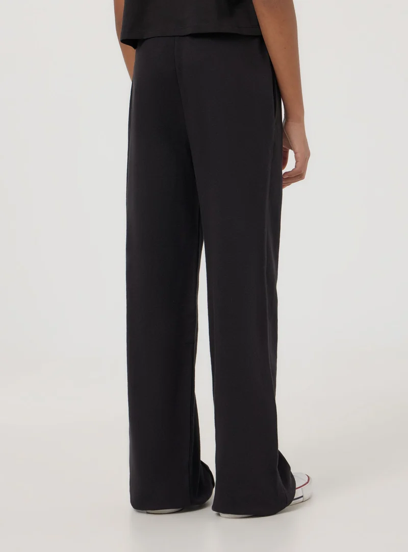 Pantaloni tuta leggeri wide leg con coulisse