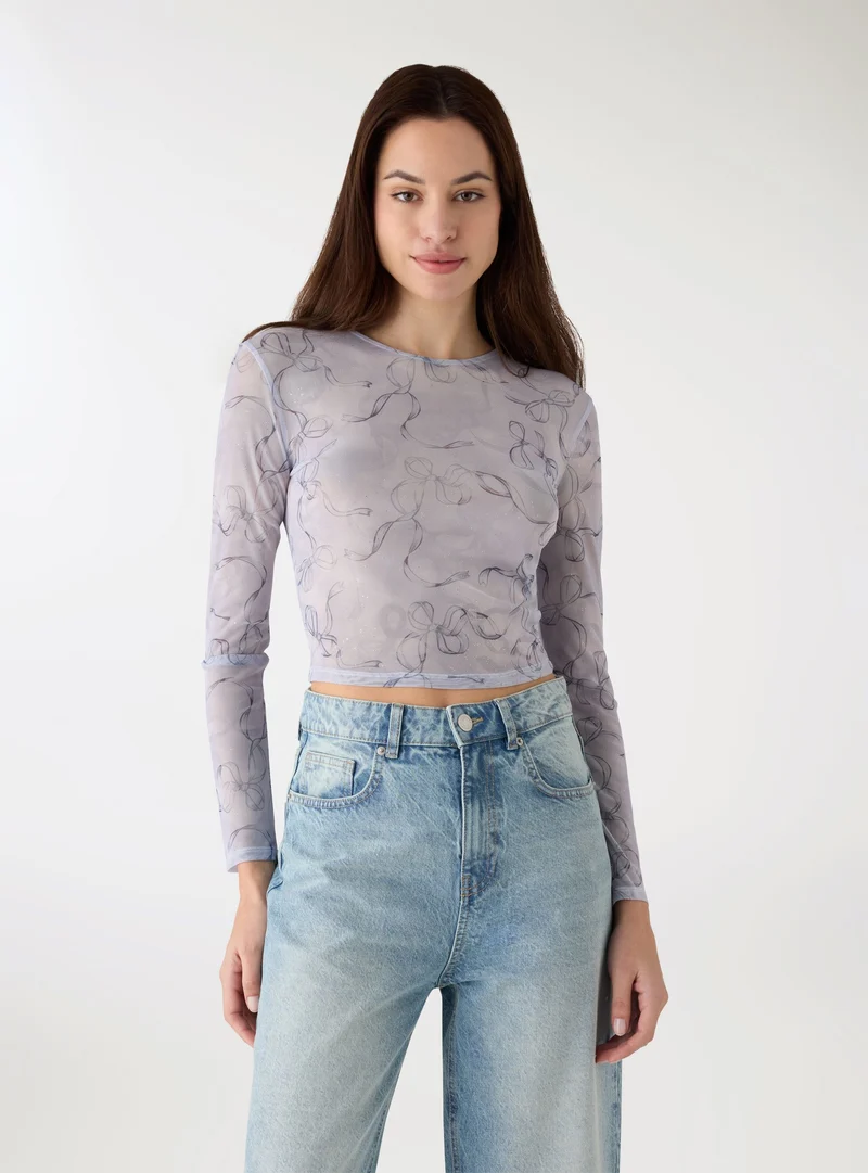 T-shirt in tulle con fiocchi e glitter