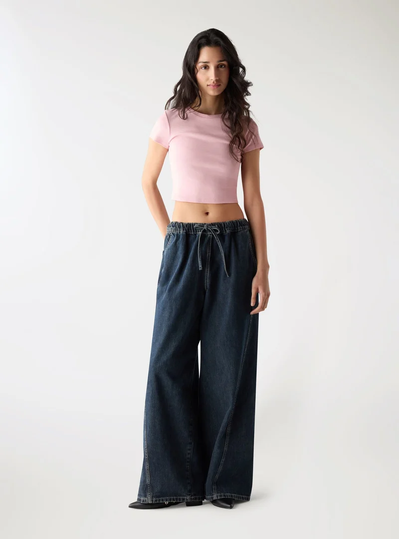 Jeans wide leg con coulisse