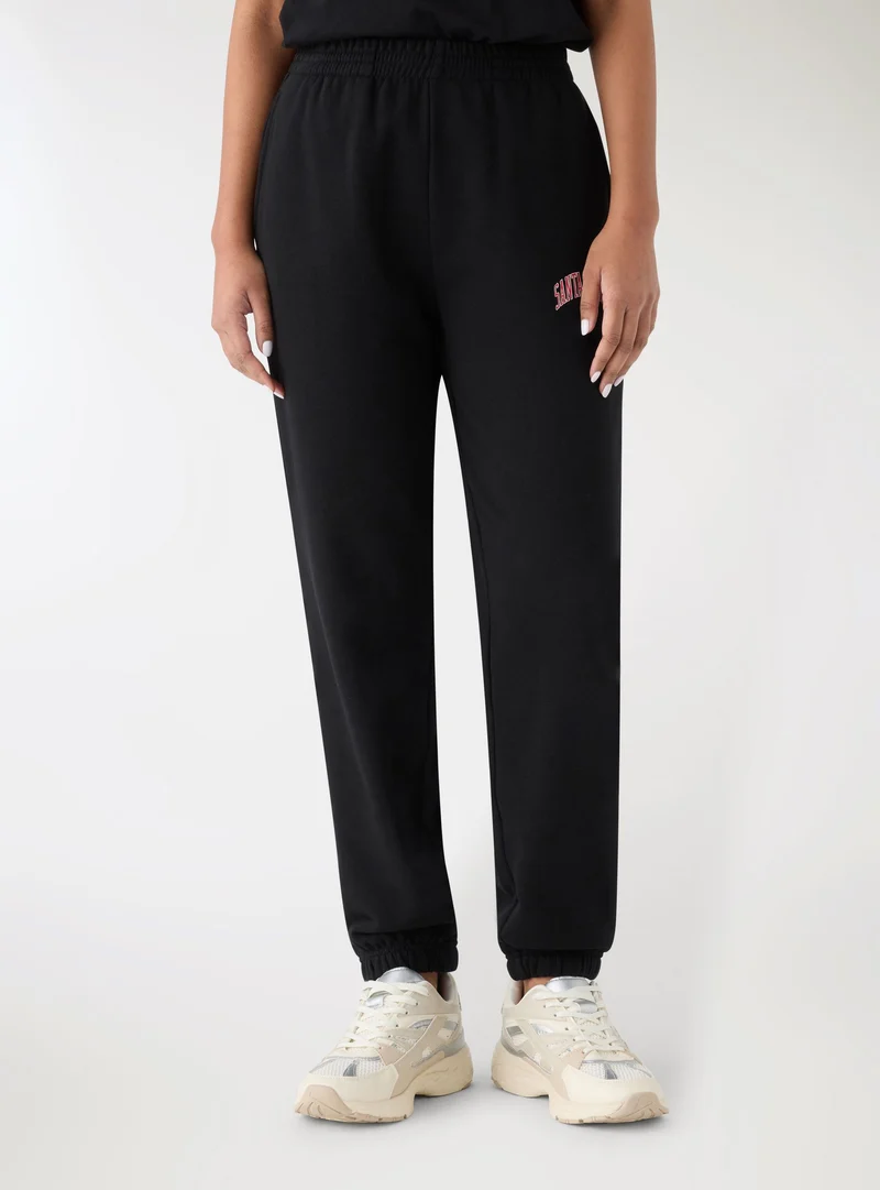 Pantaloni tuta con scritta college