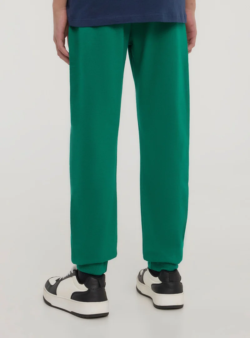 Pantaloni leggeri della tuta con stampa sportiva