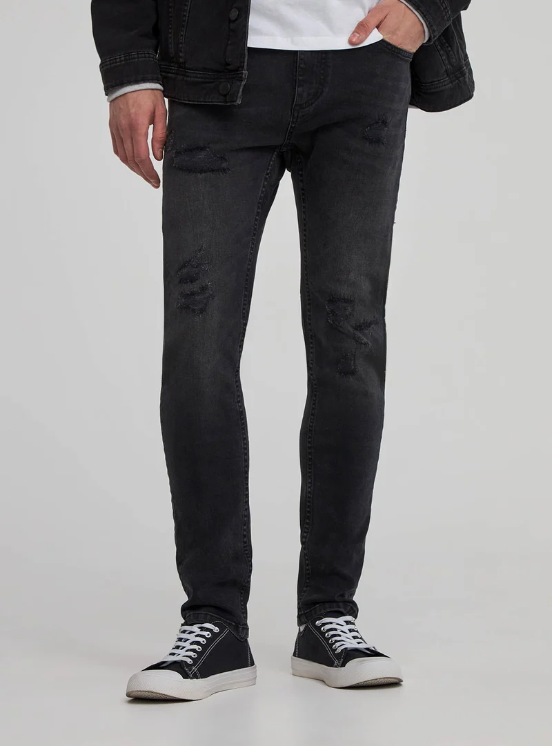 Jeans skinny con strappi