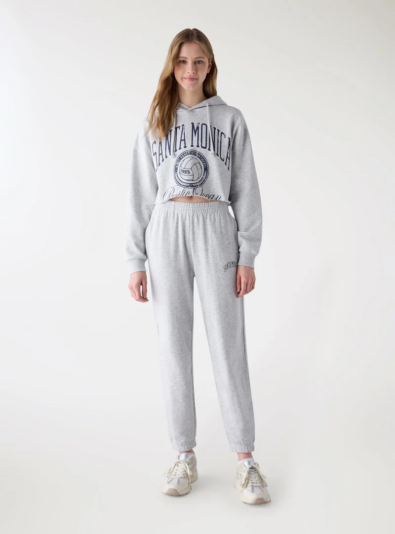 Pantaloni tuta con scritta college