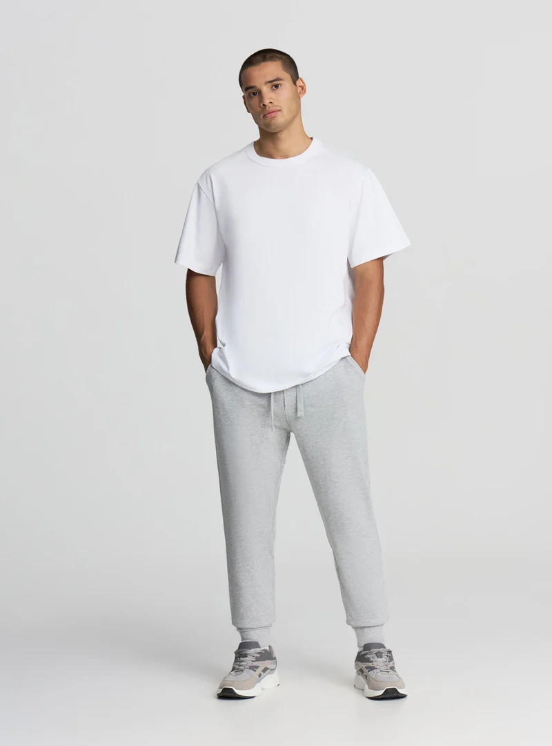 Pantaloni leggeri tuta con coulisse e tasche