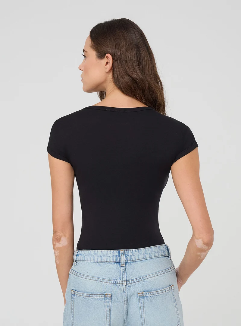 T-shirt maniche ad aletta tinta unita