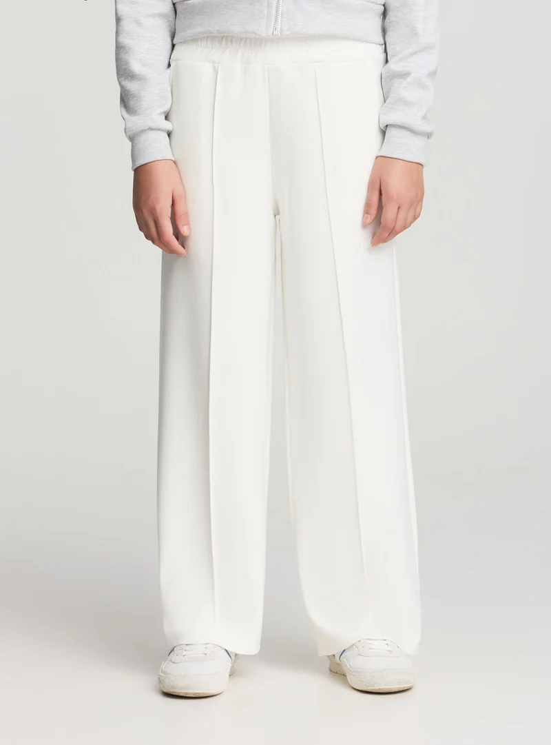 Pantaloni tuta wide leg a tinta unita