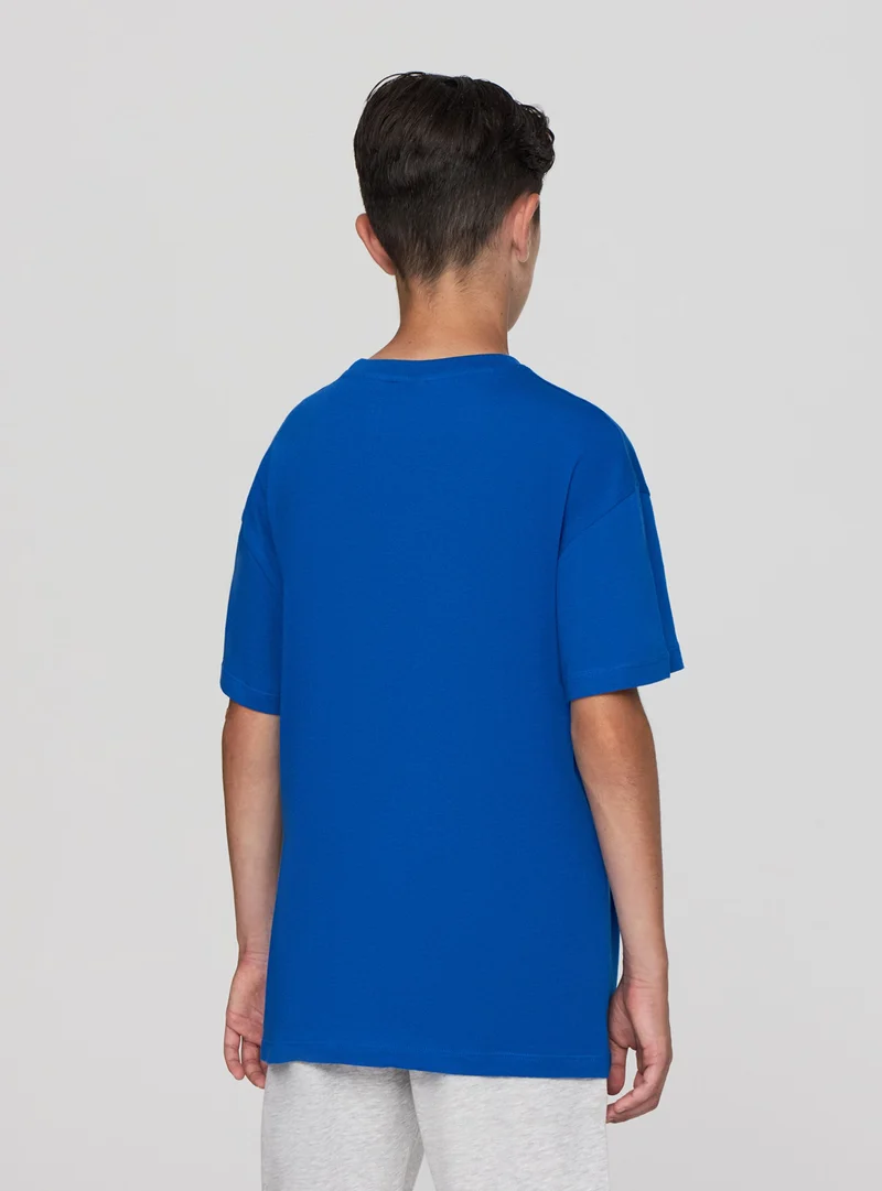 T-shirt con scritta sportiva