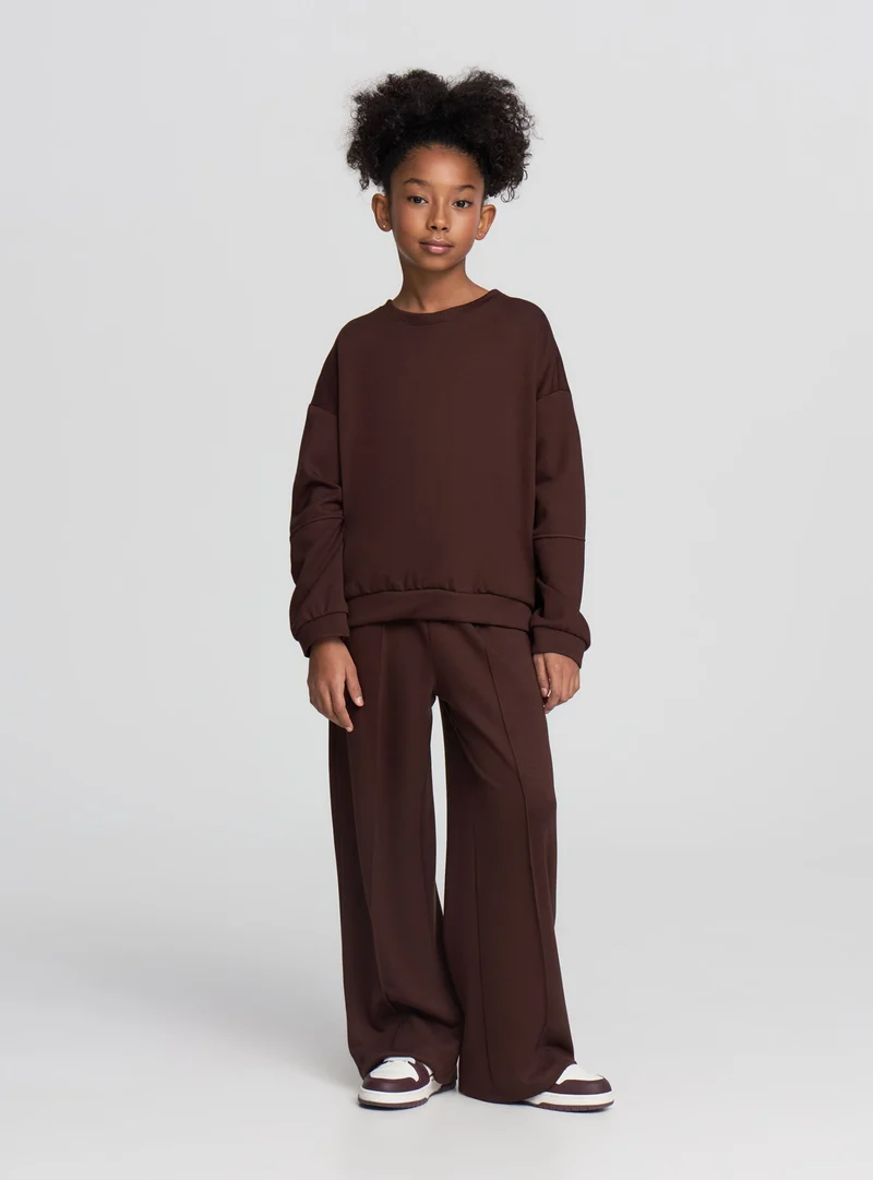 Pantaloni tuta wide leg a tinta unita