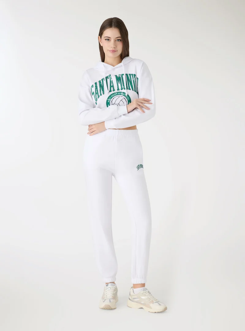 Pantaloni tuta con scritta college