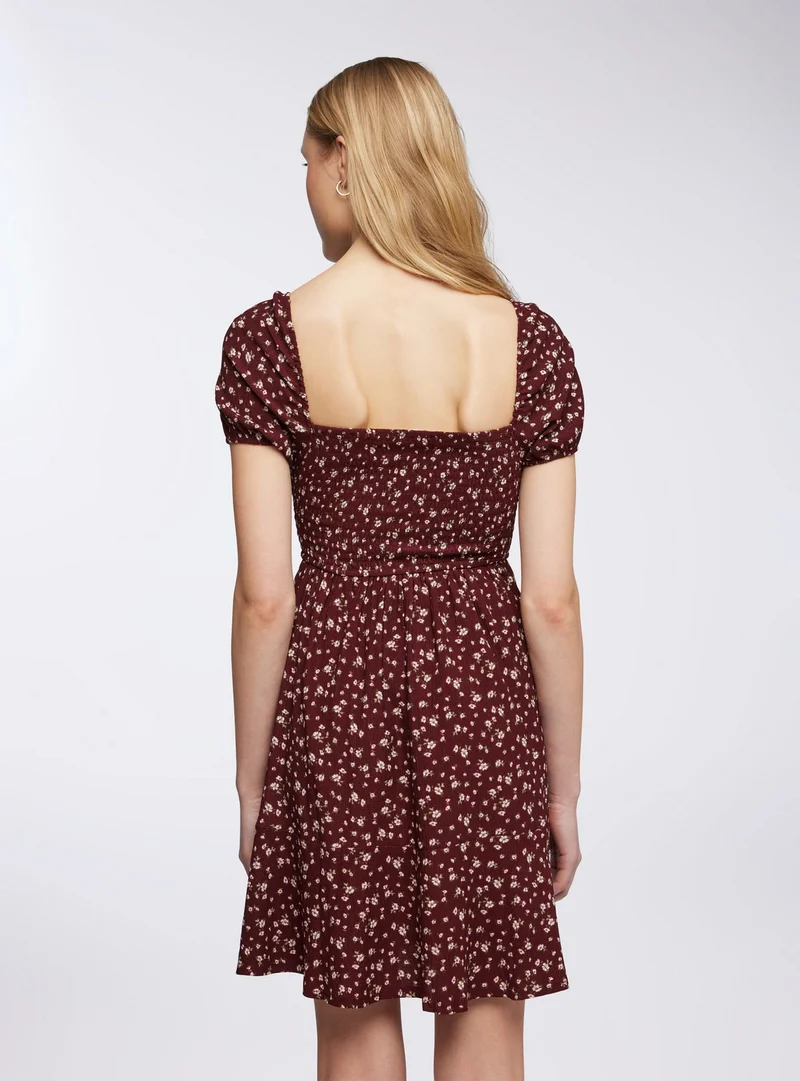 Vestito con punto smock floreale