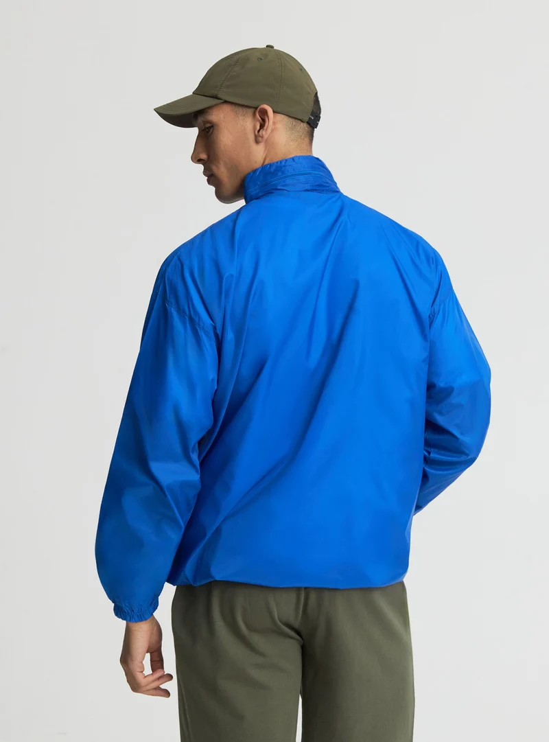 Giacca antipioggia con zip e coulisse