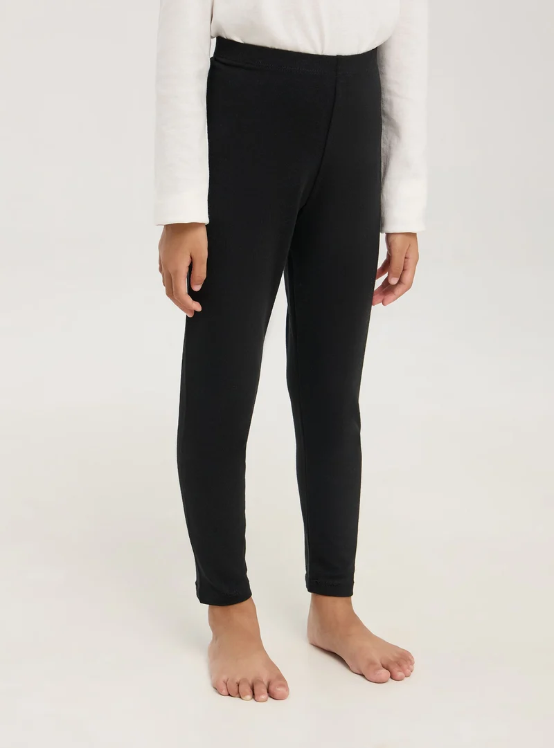 Leggings in cotone a tinta unita