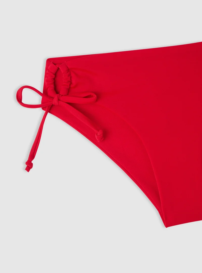 Slip bikini con laccetti ricamo logo TRN