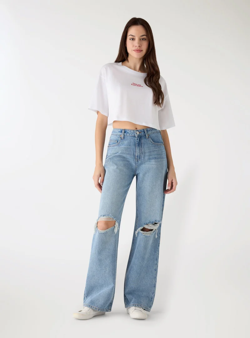 Jeans wide leg con strappi