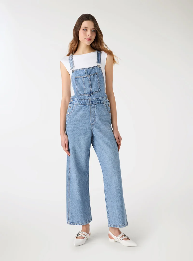 Salopette lunga in denim a tinta unita