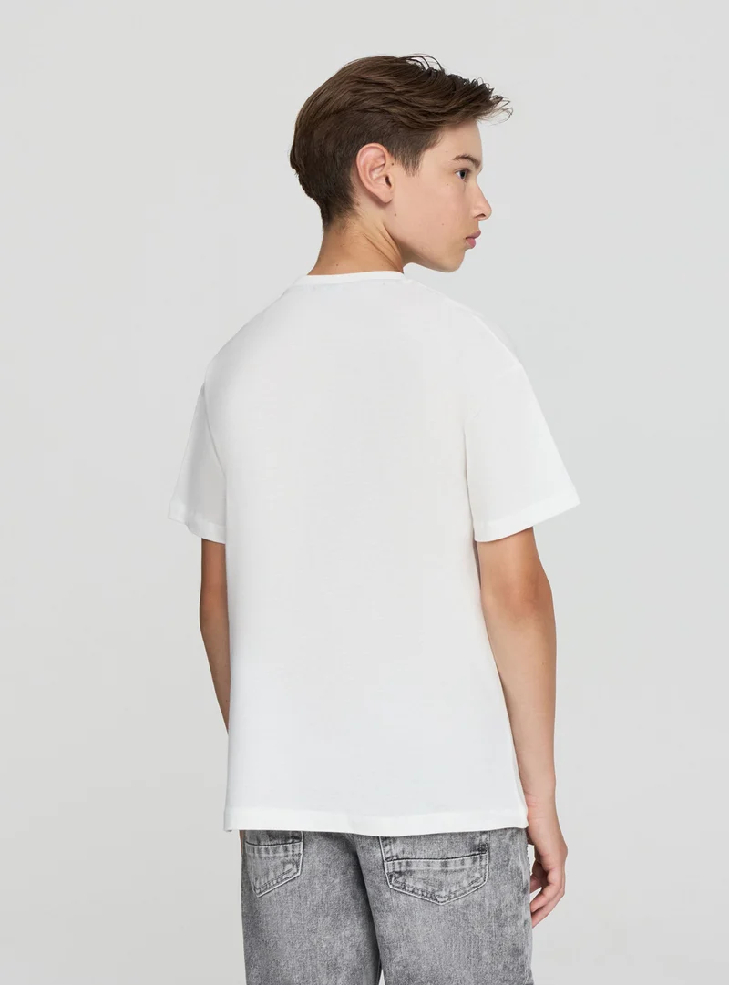 T-shirt con scritta sportiva