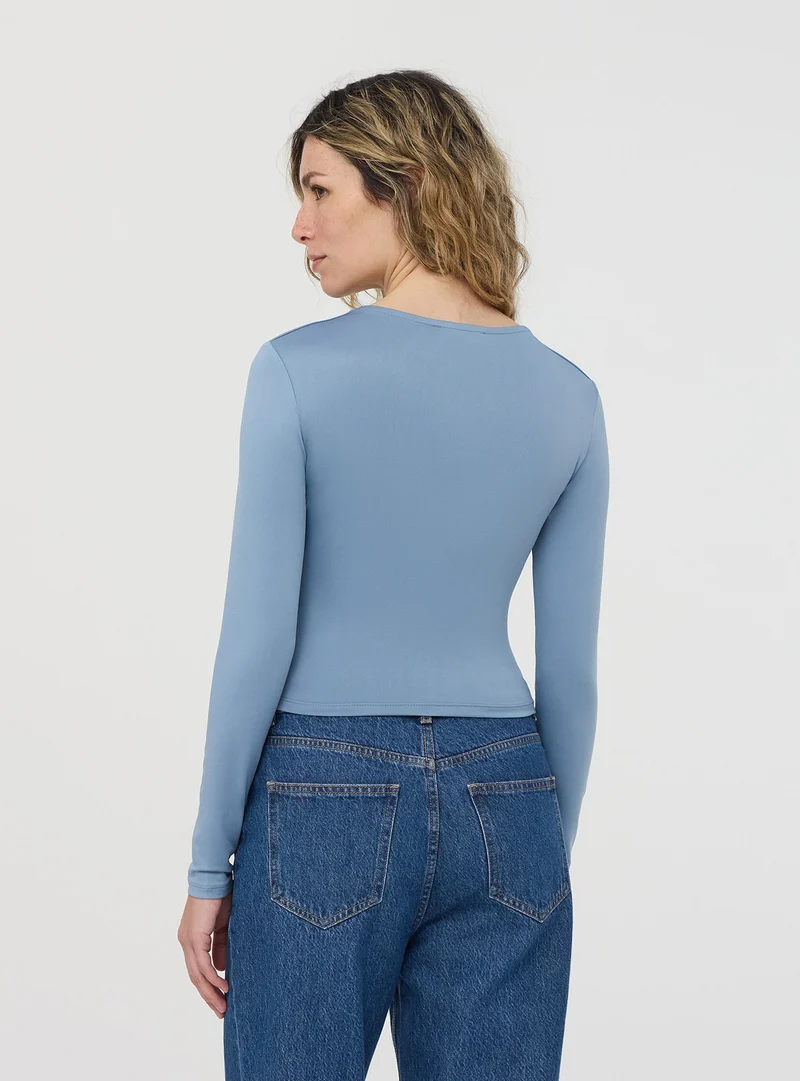 T-shirt crop a maniche lunghe