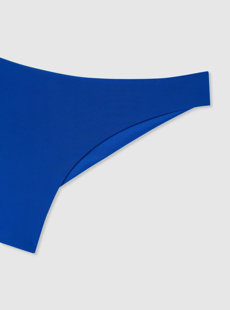 Slip bikini brasiliana tinta unita ricamo logo TRN