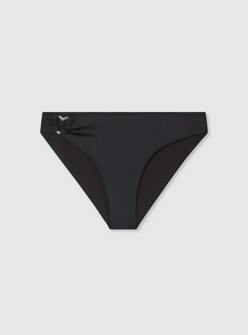 Slip bikini tinta unita con anello a cuore