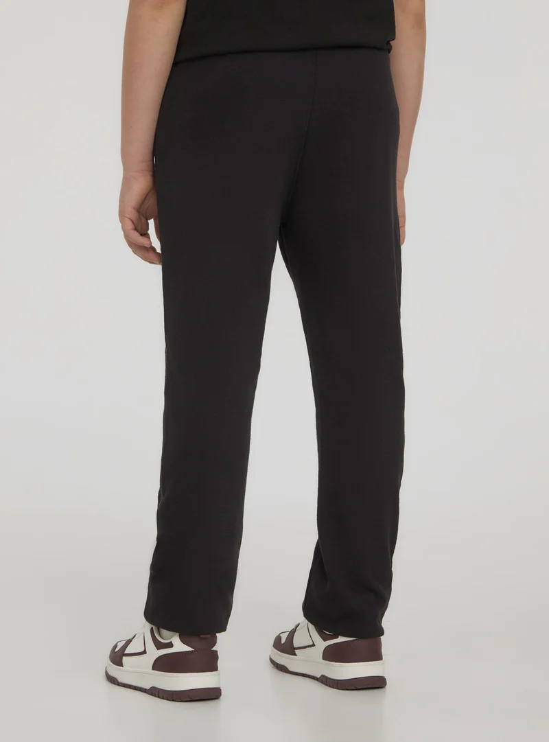 Pantaloni leggeri della tuta con stampa sportiva