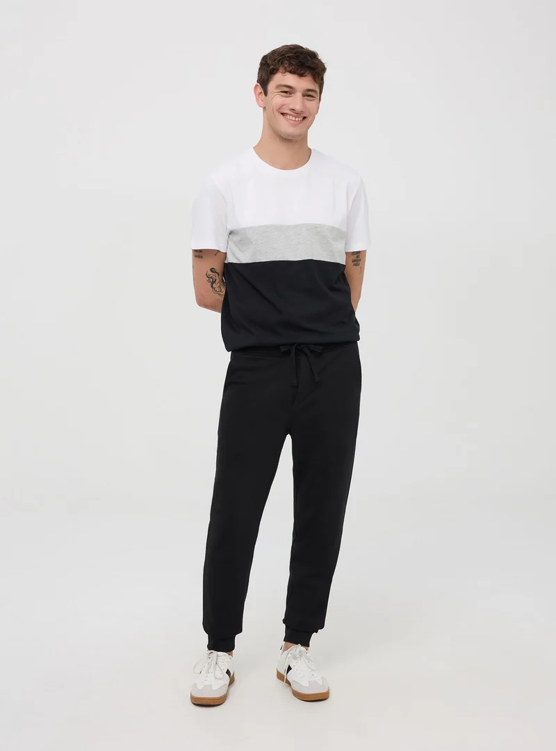 Pantaloni tuta leggeri in cotone con coulisse e tasche