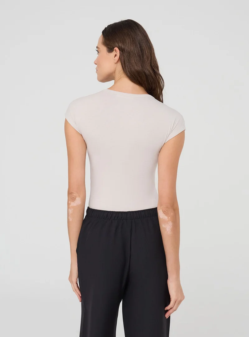 T-shirt maniche ad aletta tinta unita