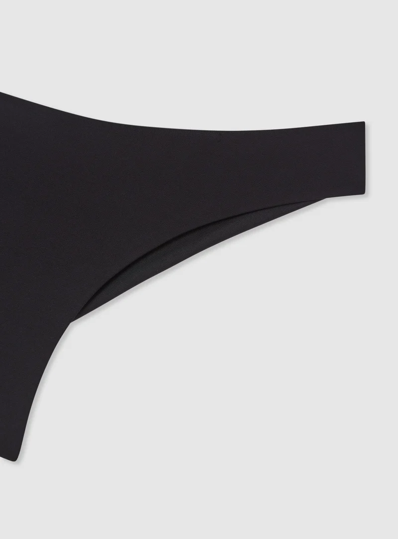 Slip bikini brasiliana tinta unita ricamo logo TRN