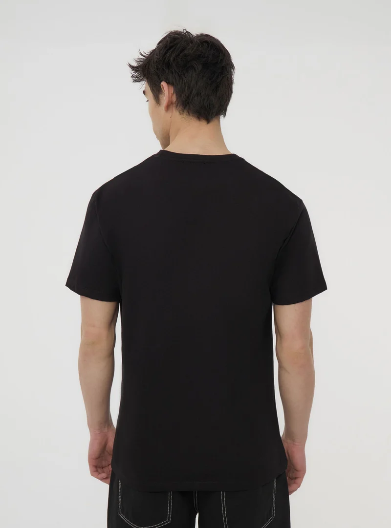 T-shirt con patch