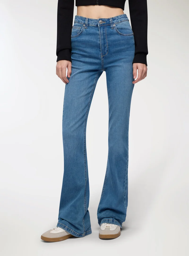 Jeans zampa a vita alta