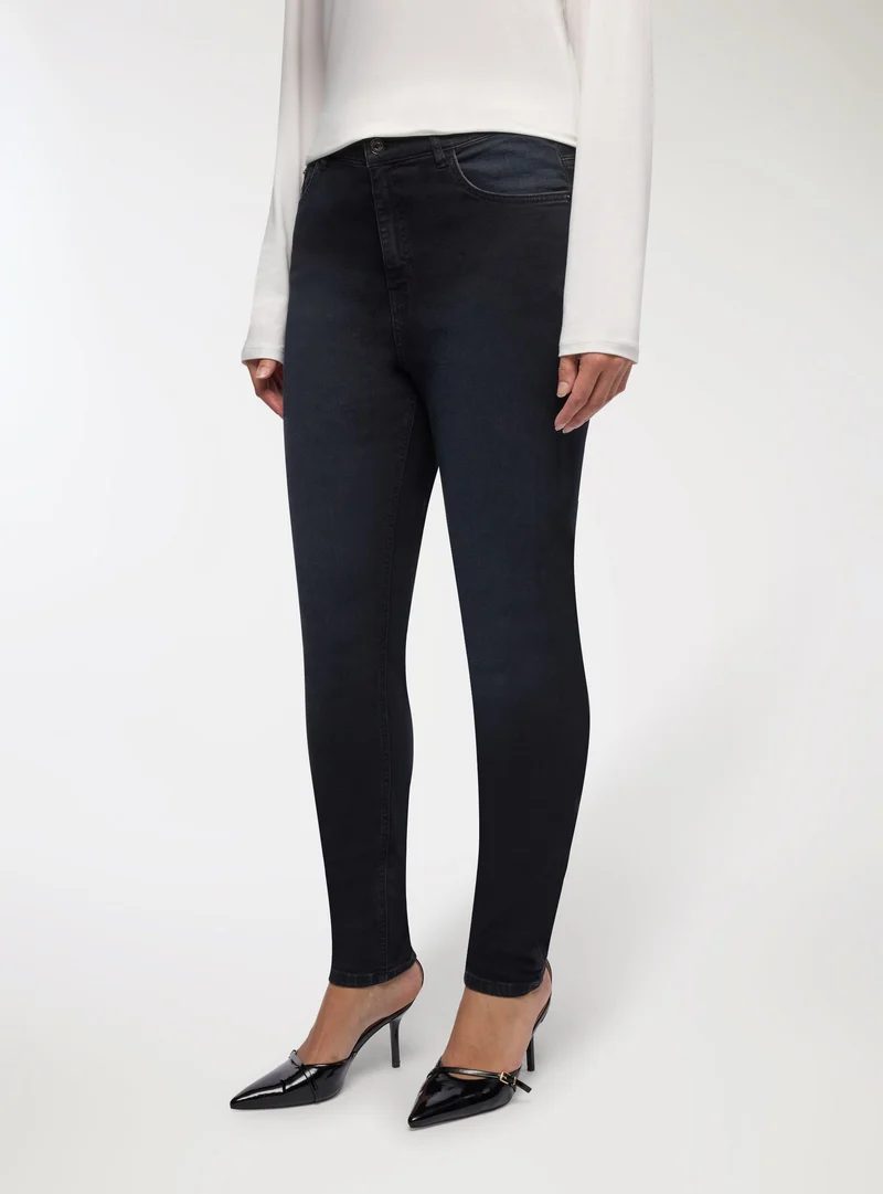 Jeans skinny a tinta unita