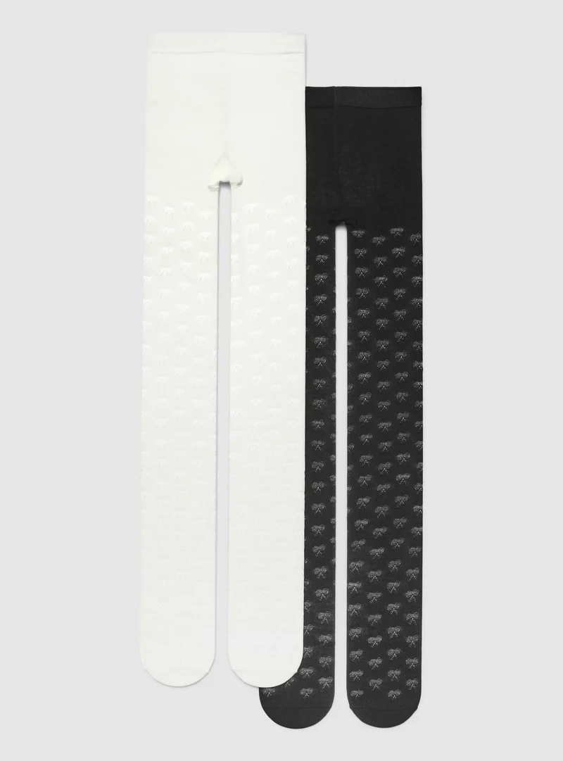 Pack 2 collant pesanti con fantasia fiocchi