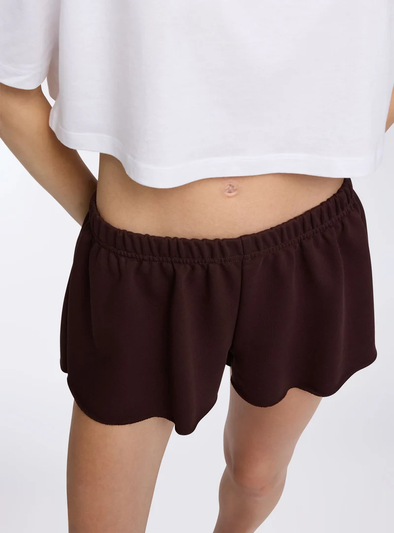 Shorts tuta a vita bassa svasati