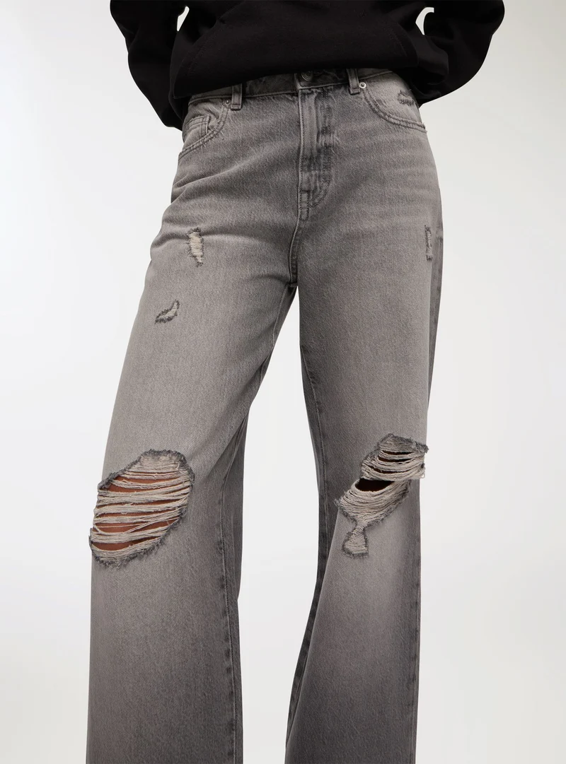 Jeans con strappi wide leg