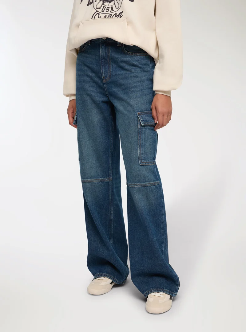 Jeans cargo scuri acid wash