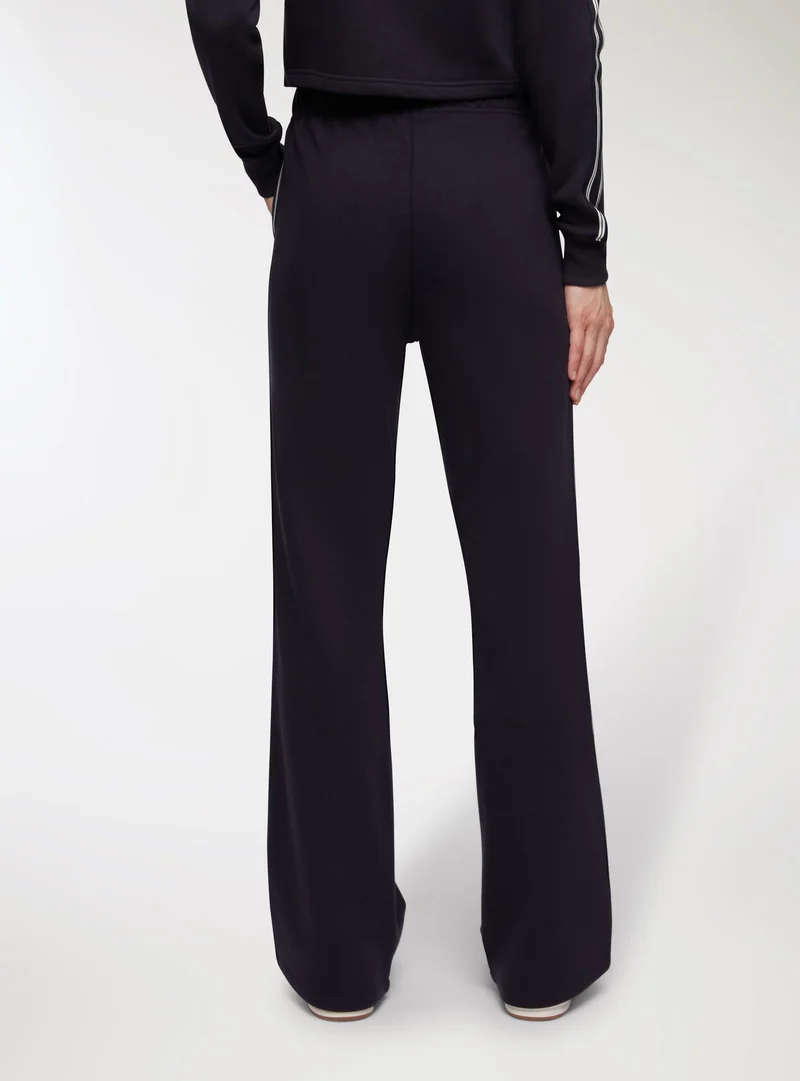 Pantaloni tuta wide leg con bande