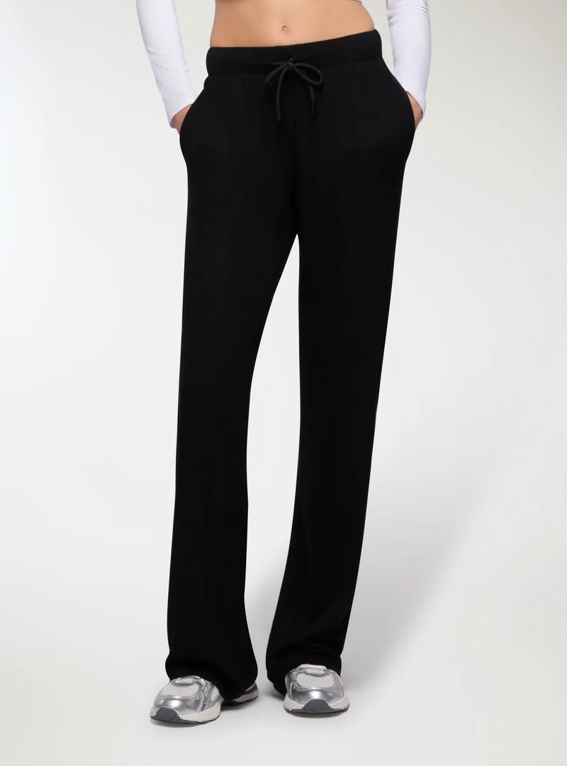 Pantaloni tuta wide leg in costina