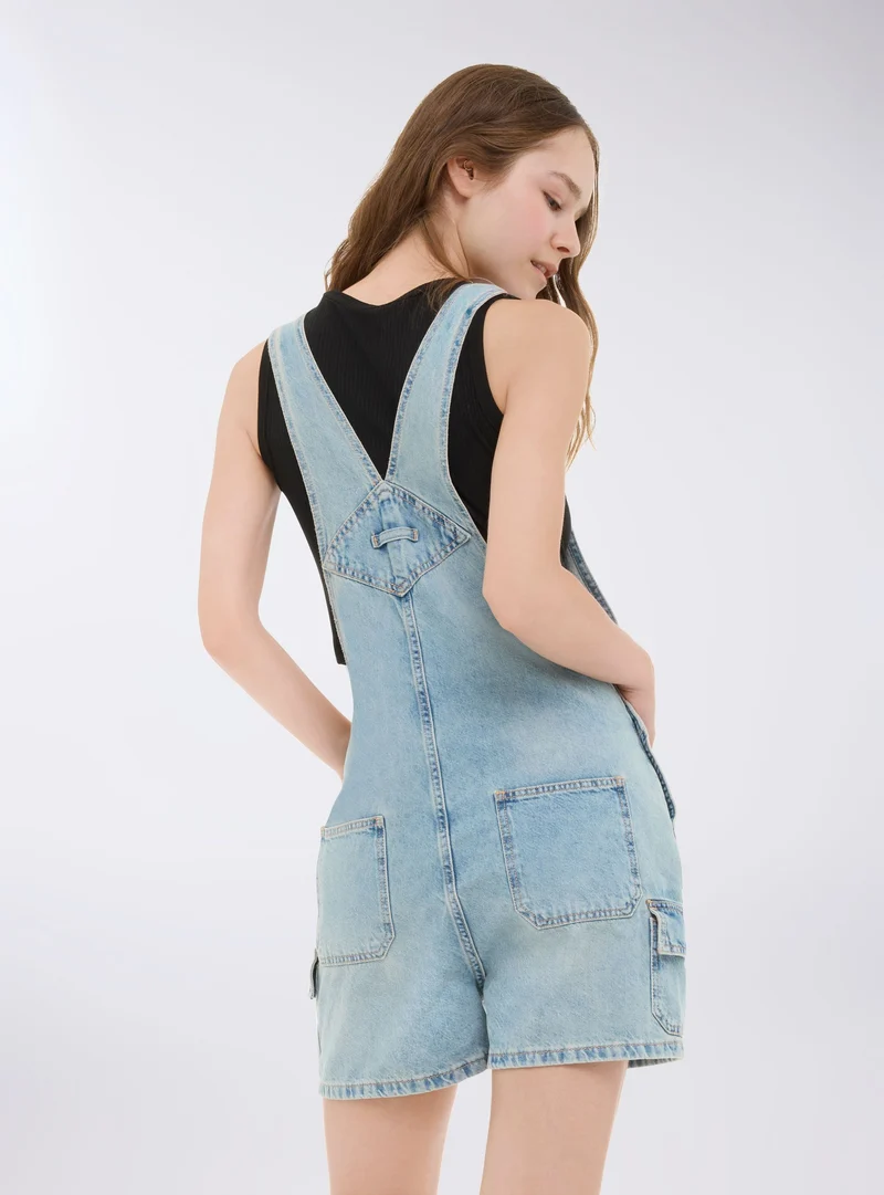 Salopette corta in denim