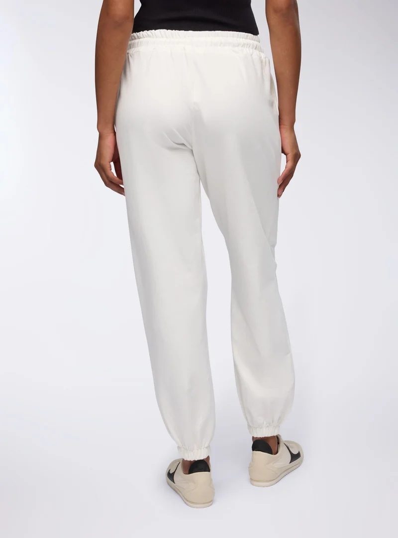 Pantaloni a vita alta con tasche laterali