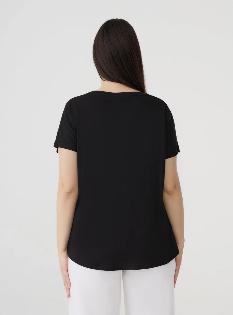 T-shirt tinta unita ampia
