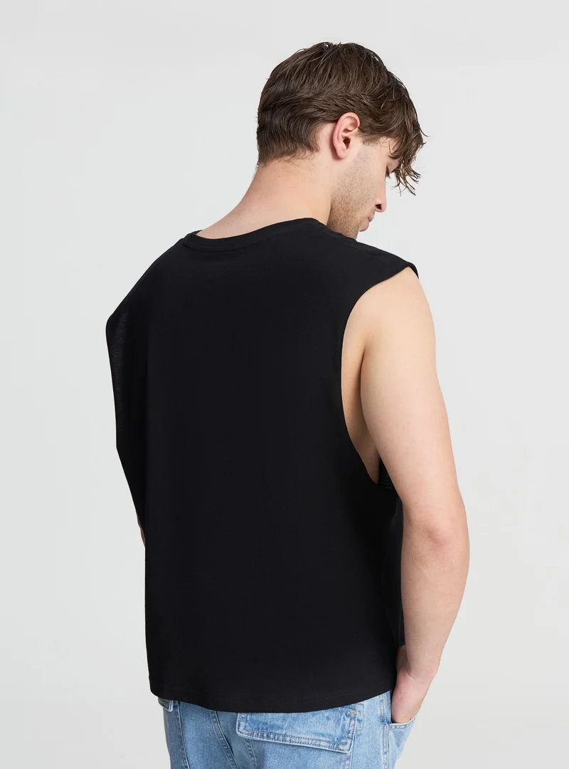 Canotta crop tinta unita smanicata