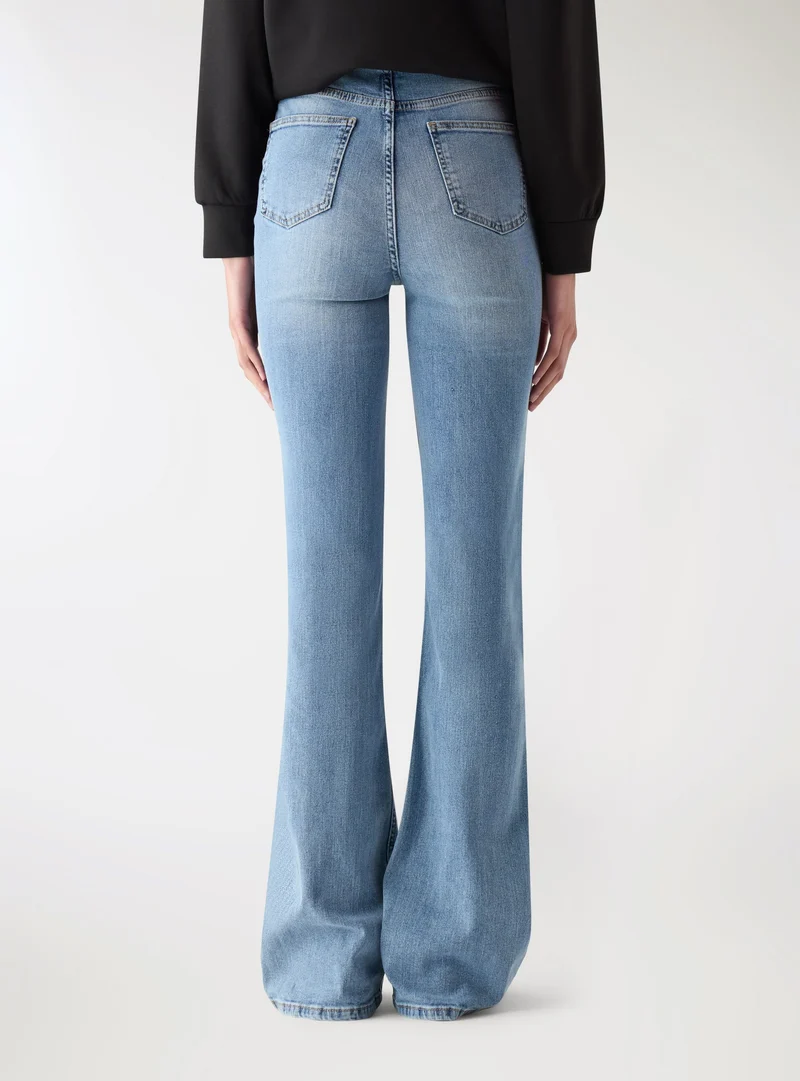 Jeans skinny vita bassa con zip