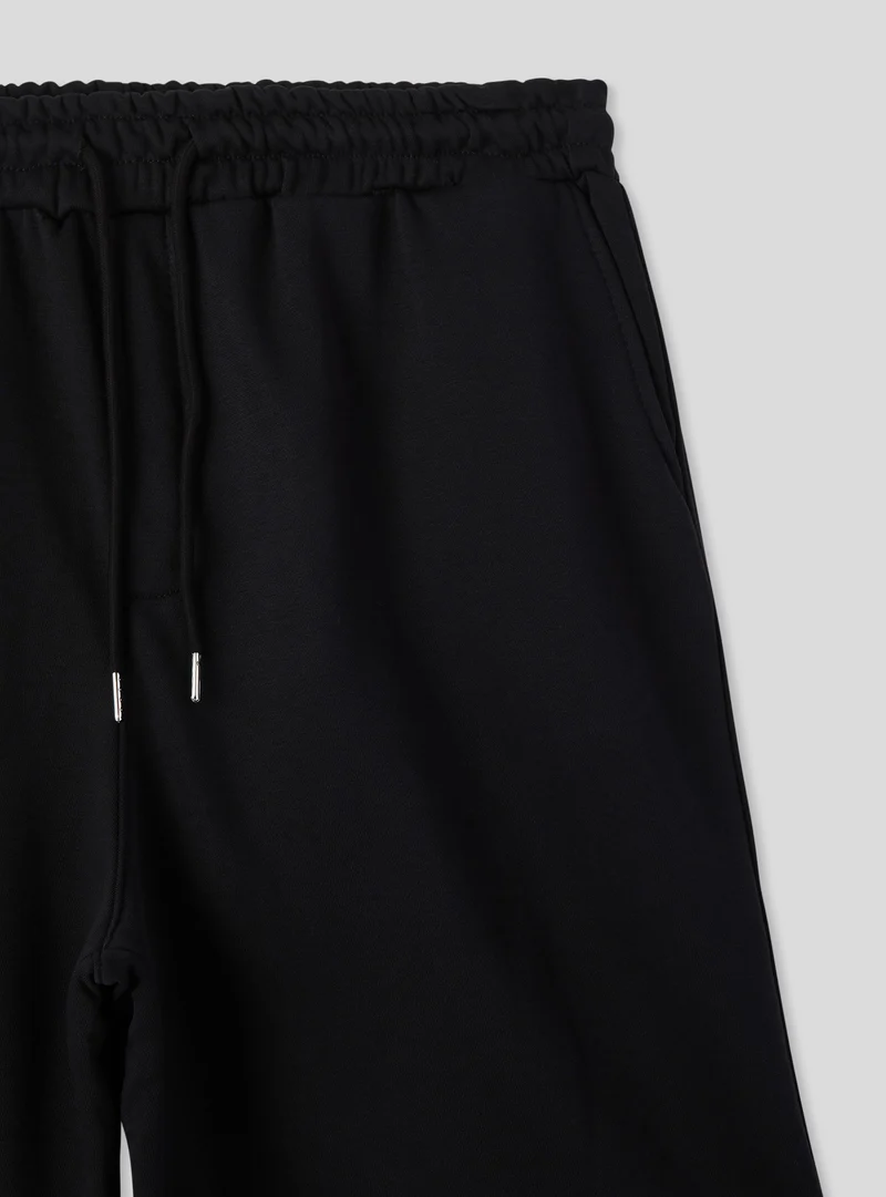 Pantaloncini tuta baggy con coulisse