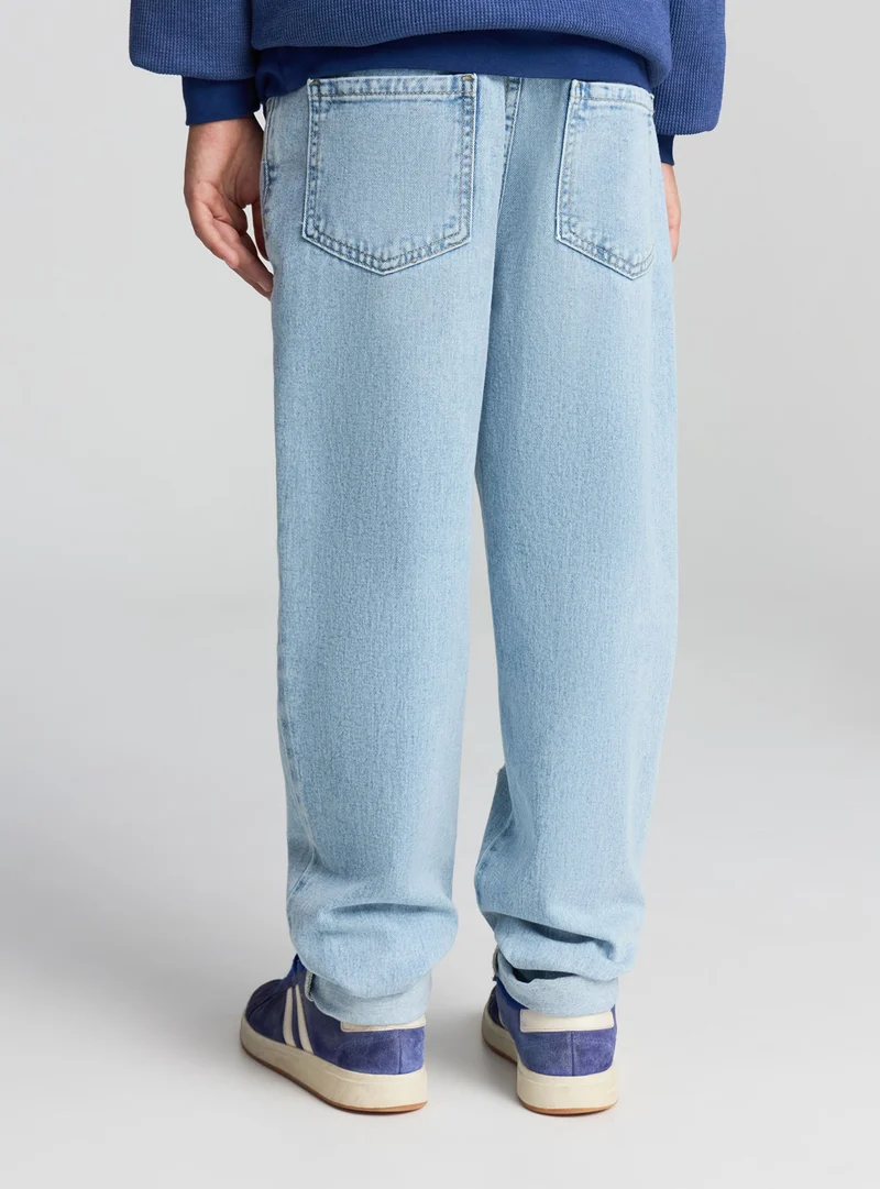 Jeans jogger con strappi